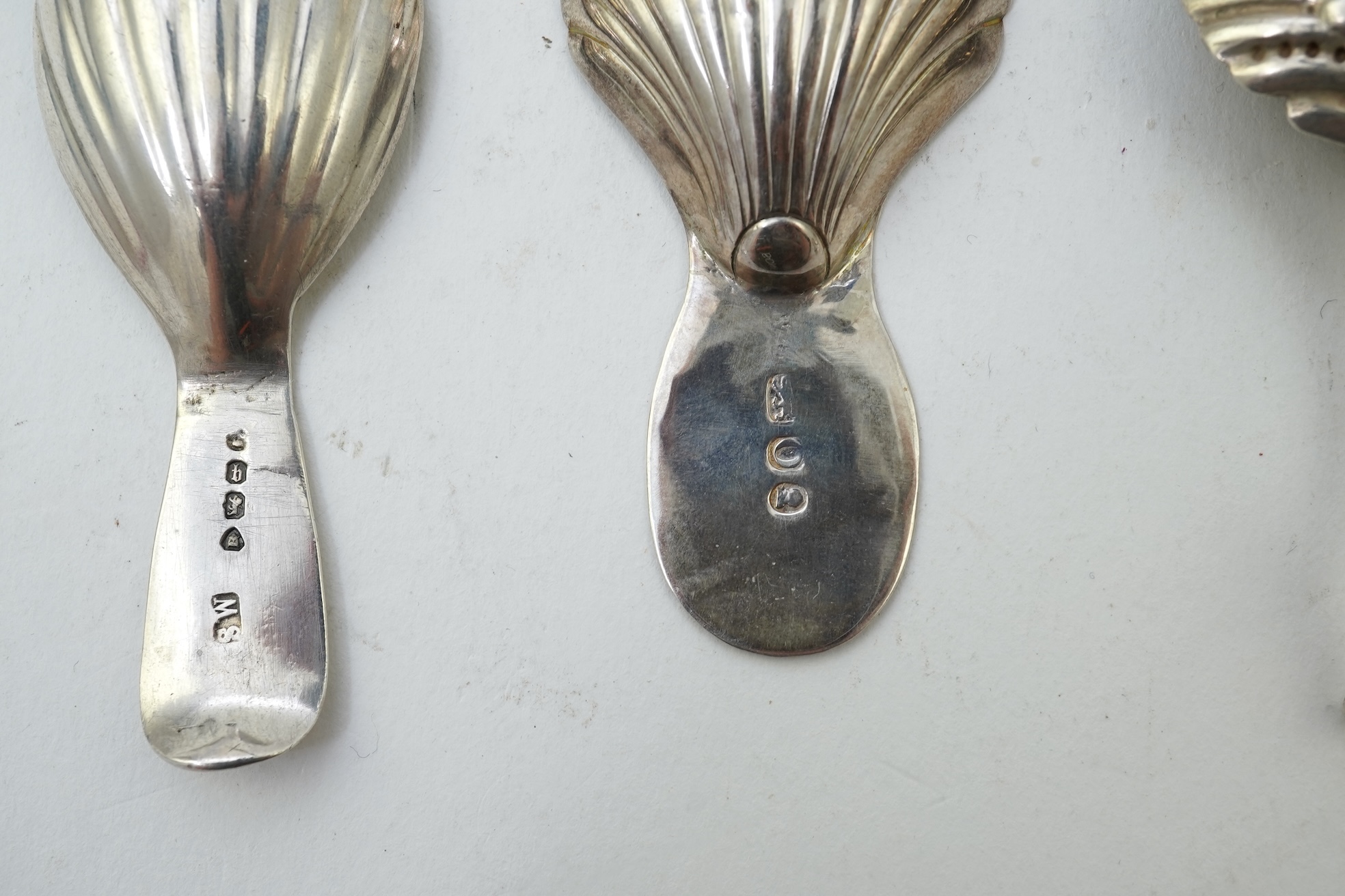 Ten assorted 19th and 20th century silver caddy spoons, with shell or fluted bowls